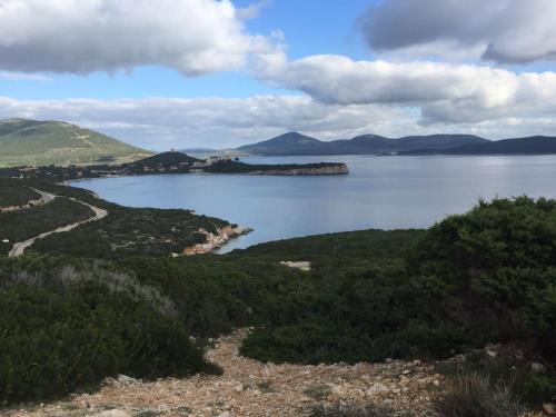 a view of a large body of water at Arenosu Comfort Country Guesthouse in Fertilia