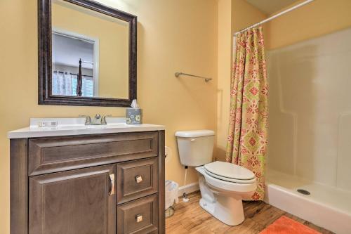 a bathroom with a sink and a toilet and a mirror at Jackson Getaway and Yard, 4 Mi to High Falls SP in Jackson