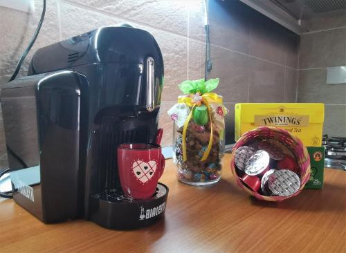 a coffee maker on a counter next to a box at La Casa di Mosè in Vigna di Valle