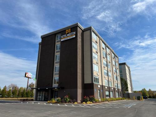 a building with a sign on the side of it at Hotel Weston in Marietta