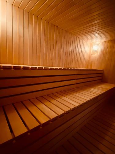 an empty wooden sauna with a light on it at Гостинний дім Александрія in Berehove