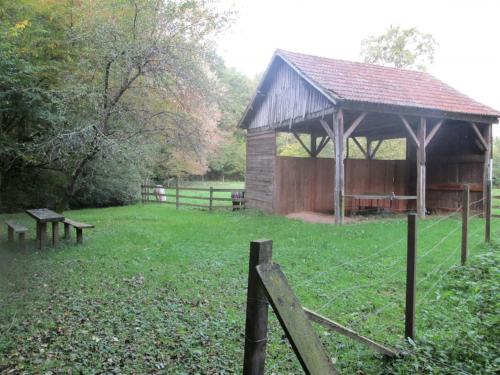 a gazebo with a bench in a field at Gîte Familial avec Cascade, Pêche, Activités et Proximité de Vichy - FR-1-489-21 in Barrais-Bussolles