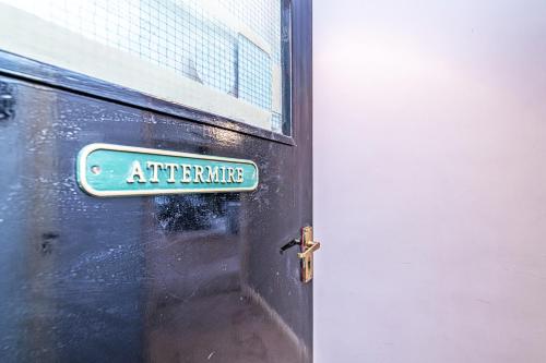 a door with a sign that reads alternative on it at Bridge End Mill by Guestz in Settle