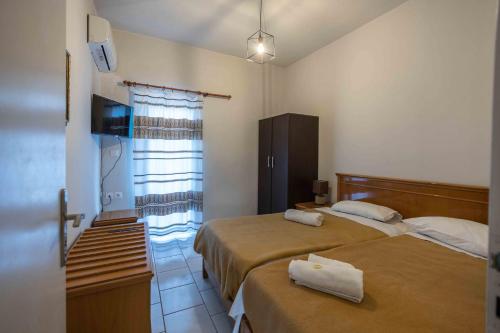 Ένα ή περισσότερα κρεβάτια σε δωμάτιο στο Villa Klados