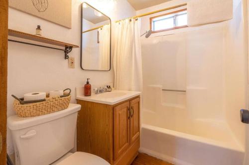 a bathroom with a toilet and a sink and a shower at Amazing Cabin - Close To Ski Resort and Village in Big Bear Lake