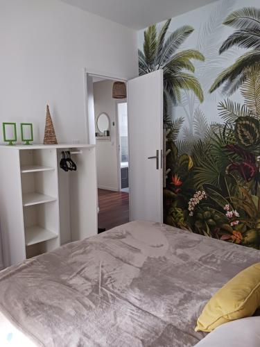 Ένα ή περισσότερα κρεβάτια σε δωμάτιο στο Les Apparts' Hotel du Canal