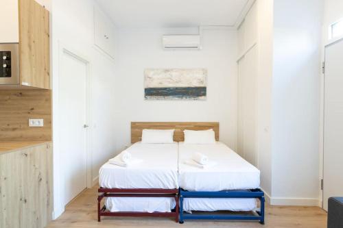 Coqueto apartamento en la calle Caribe. A/C WIFI tesisinde bir odada yatak veya yataklar
