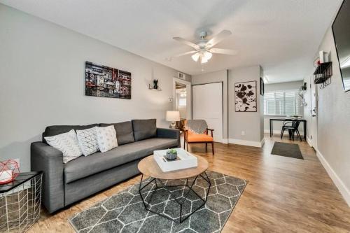 a living room with a couch and a table at Global Cup The Eastside Flat Arboretum Tickets Included in Dallas