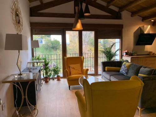 Χώρος καθιστικού στο Apartamentos en el Valle del Jerte Flores para Angela