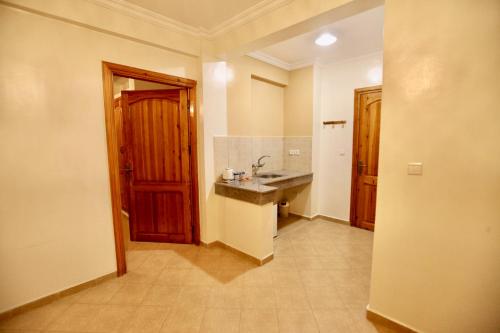 a bathroom with a sink and a counter top at Atlantica Ifri Surf Suites in Tamraght Ou Fella