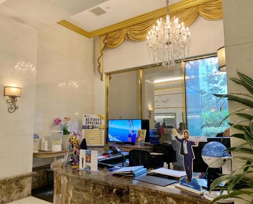 a statue of a woman standing on a desk in a room at Vacation Rental Studios at Royal Garden Waikiki in Honolulu
