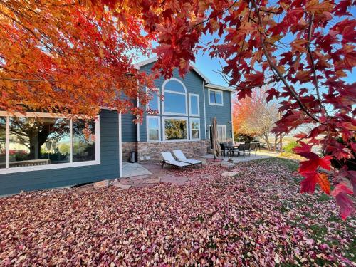 a house with autumn leaves on the ground at Family-friendly Home on Boyd Lake, Gorgeous Views! in Loveland