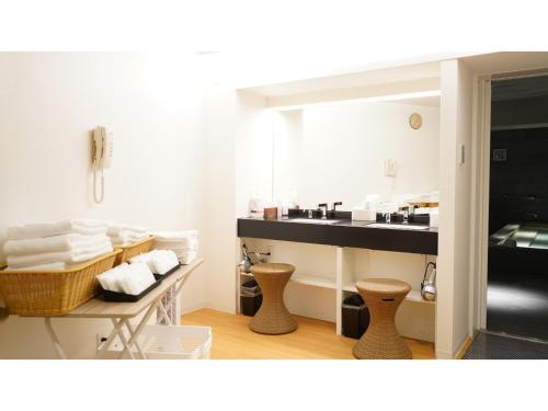 a bathroom with a sink and a mirror at Hotel Tenpyo Naramachi - Vacation STAY 59515v in Nara