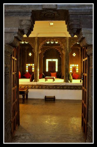 a large room with a large bed in a building at Madri Haveli in Udaipur