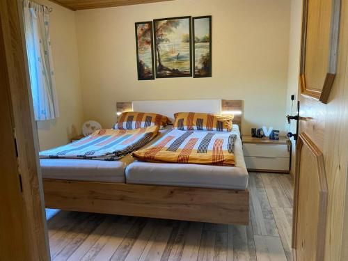 a bedroom with a bed with two pillows on it at Landler Auszeit in Thiersee