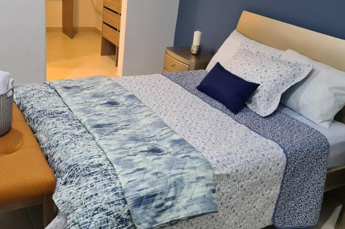 Кровать или кровати в номере AltoVento905