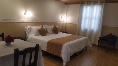 Cama ou camas em um quarto em Hotel La Gran Casona