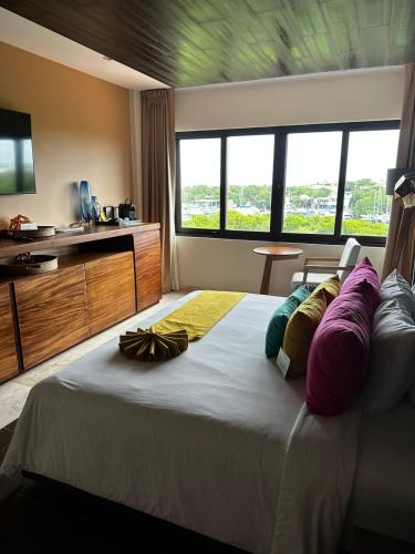 Postel nebo postele na pokoji v ubytování Hotel Beló Isla Mujeres - All Inclusive - Sargassum Free