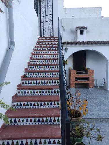 a staircase leading up to a building with a piano at CAL TIO PAU in Orba