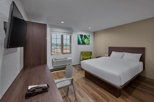 Postel nebo postele na pokoji v ubytování Extended Suites Chihuahua La Juventud