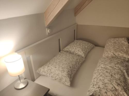 Postel nebo postele na pokoji v ubytování Kosbor Vendégház