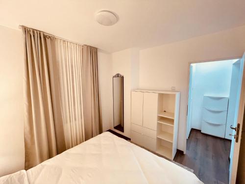 Ένα ή περισσότερα κρεβάτια σε δωμάτιο στο Twin Apartments