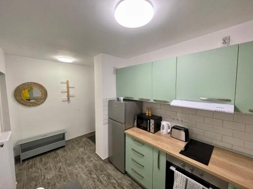 Η κουζίνα ή μικρή κουζίνα στο Twin Apartments