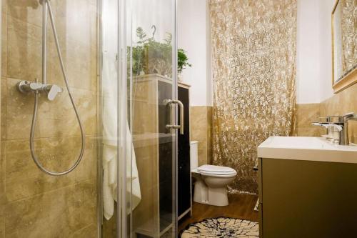 a bathroom with a shower and a toilet and a sink at B&B Old Town San Marino in San Marino