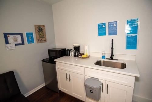 a kitchen with a sink and a coffee maker at Cozy Studio Apartment close to Disney in Davenport