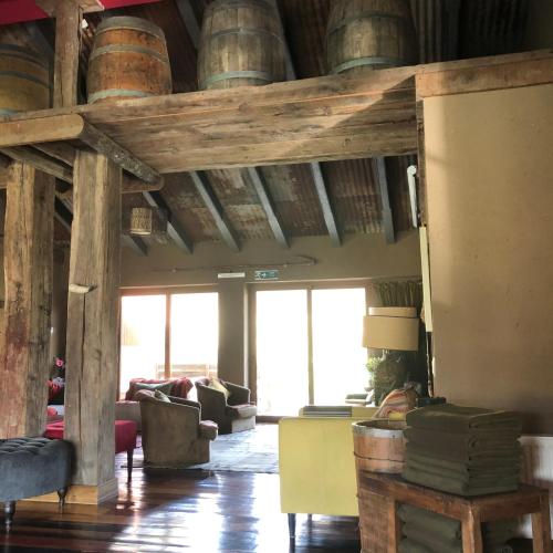 a living room with wooden barrels on the ceiling at Hotel Boutique BC Wine Casablanca in Casablanca