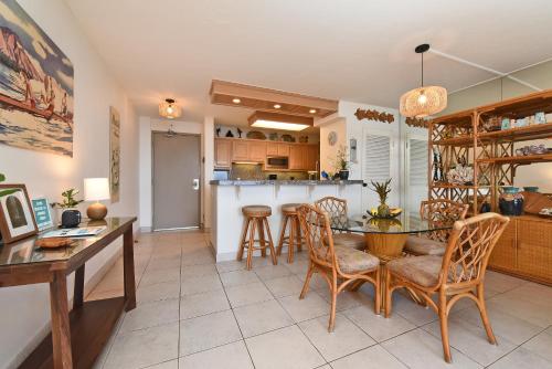 a kitchen and dining room with a table and chairs at May on Sale! Book Now for May and SAVE BIG! in Kahana