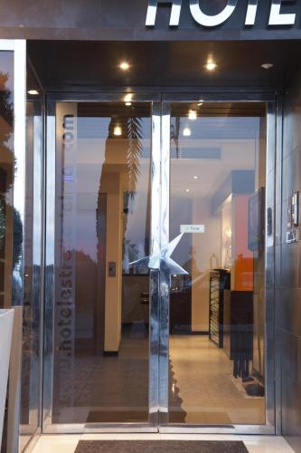 a window of a store with a wind turbine on it at Hotel Boutique Estrella del Mar in Peñíscola