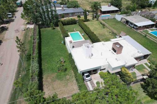 an aerial view of a house with a swimming pool at LA CASITA in Roldán
