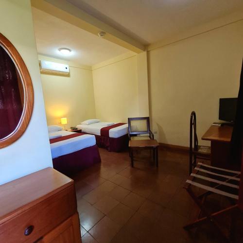 Ένα ή περισσότερα κρεβάτια σε δωμάτιο στο Hotel Austria