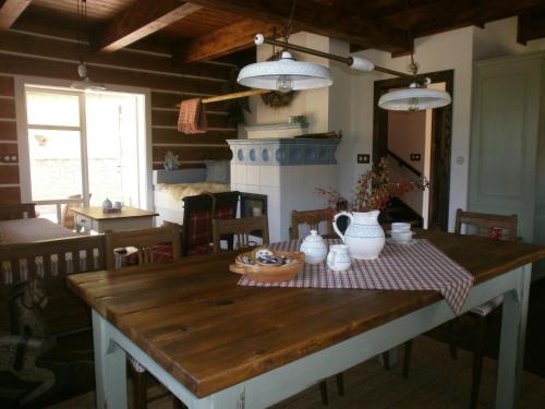 a dining room table with a checkered table cloth at Penzion Roubenka in Hukvaldy