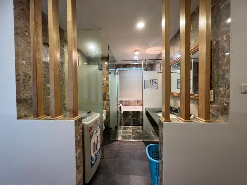 a bathroom with a washer and dryer in a room at HANA Stay Riverside in Hanoi
