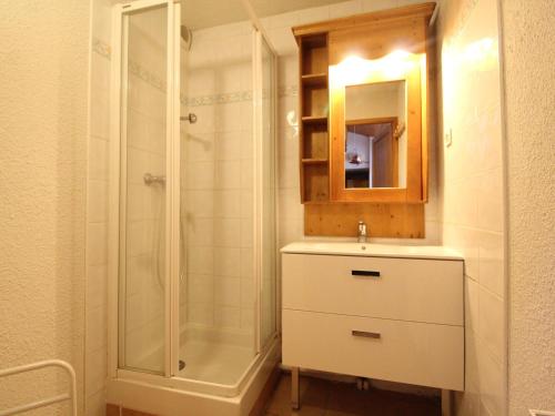 a bathroom with a shower and a sink and a mirror at Appartement Duplex 10-12 Pers. avec Balcon, à 20m des Pistes - Val Cenis - FR-1-508-69 in Lanslevillard