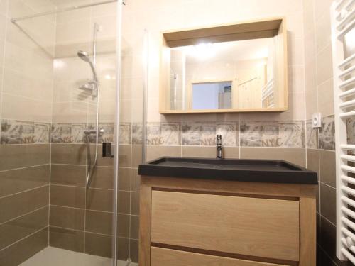 a bathroom with a sink and a shower at Appartement Lanslebourg-Mont-Cenis, 4 pièces, 8 personnes - FR-1-508-38 in Lanslebourg-Mont-Cenis