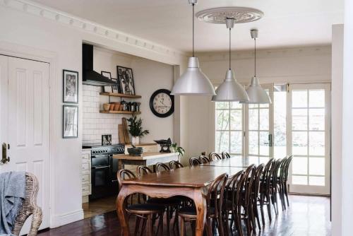 a kitchen and dining room with a table and chairs at The Manor House Daylesford in Daylesford