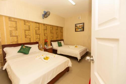 En eller flere senger på et rom på HANZ Bao Khoi Hotel