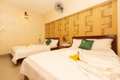 En eller flere senger på et rom på HANZ Bao Khoi Hotel