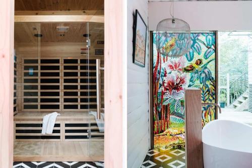 a bathroom with a shower and a glass door at The Oxford - Hepburn Springs Daylesford in Hepburn Springs