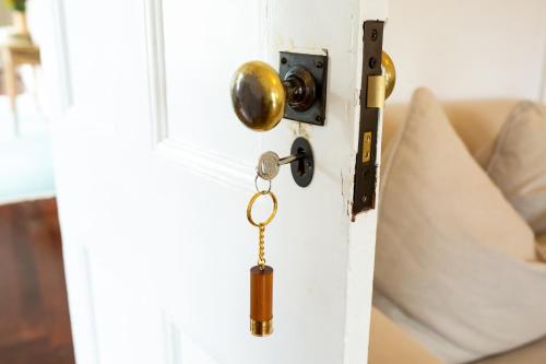 a door with a key hanging from it at Mount William Station in Willaura