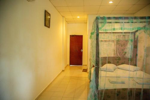 Katil atau katil-katil dalam bilik di Lake Edge Holiday Inn
