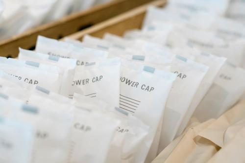 a group of white bags of over cap bags at Hotel JAL City Haneda Tokyo West Wing in Tokyo