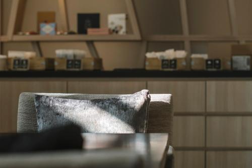a chair with a pillow sitting in a room at Hotel JAL City Haneda Tokyo West Wing in Tokyo