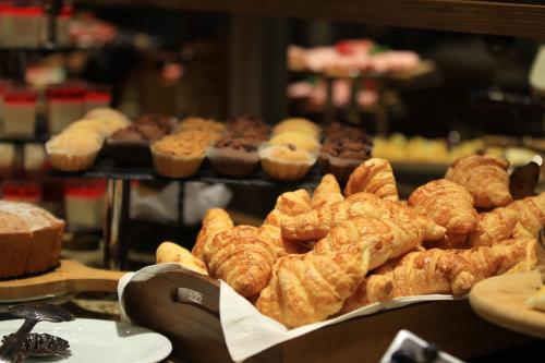a display of pastries and muffins in a bakery at Marco Polo Hotel Gudauri in Gudauri