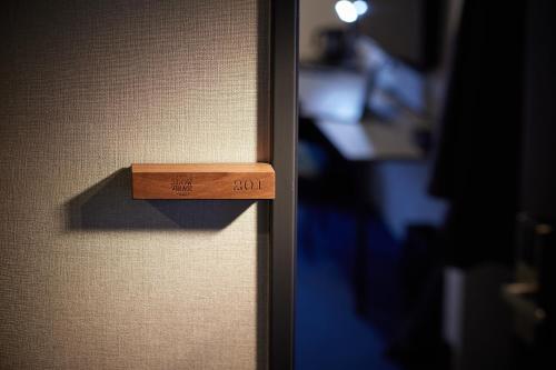 Hotel Slow Village Yonezawaにあるベッド