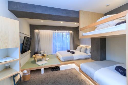 Katil atau katil-katil dalam bilik di Sakura Cross Hotel Ueno Iriya Annex