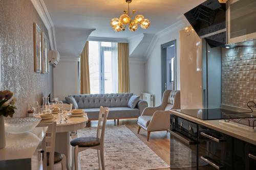 a kitchen and living room with a couch and a table at Fully Equiped Apartment In Istanbul Avcilar - Zarif-60 in Avcılar